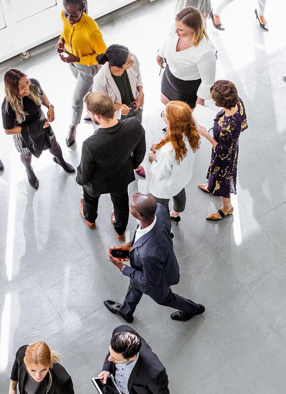 Workplace professionals Professionals walking and talking in a corporate environment